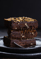 Dark Chocolate Brownies Stacked on a Plate