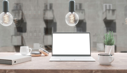 Generic laptop computer and coffee cup resting on wooden table. Blank screen for mockup