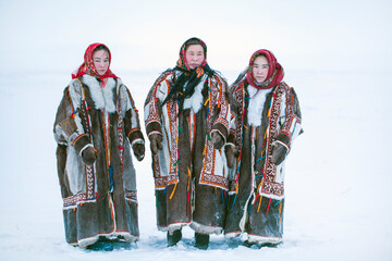 Yamalo-Nenets Autonomous Okrug, extreme north, Nenets family in the national winter clothes of the northern inhabitants of the tundra, the Arctic circle
