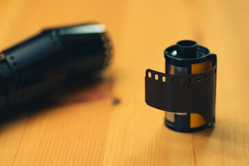 Fototapeta na wymiar 35mm negative camera film on a wooden background