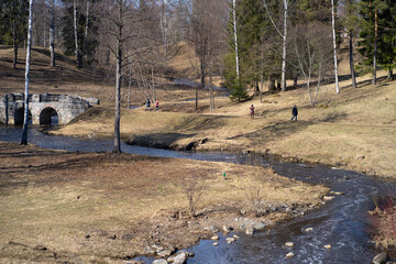 river and people walking in the park