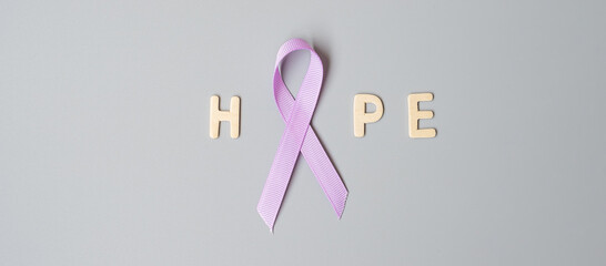 World cancer day (February 4). Lavender purple ribbon for supporting people living and illness....