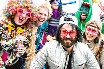 Happy friends celebrating a carnival party