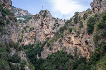 The small haven of Amalfi village with the tiny beach and colorful houses, located on the rock, Amalfi coast, Sorrento, Italy