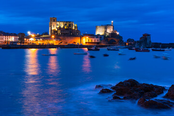 Castro Urdiales old town at dusk, with Santa Ana Church and Castillo Lighthouse, Cantabria, Spain, Europe