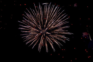 Background of fireworks exploding in the sky at night to celebrate holiday