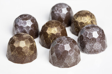 chocolate truffles with golden and silver shimmer