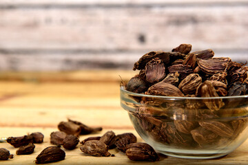 Organic Black cardamom on a glass ramekin