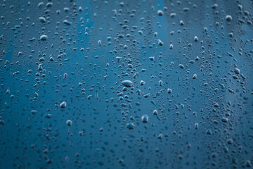 Water participles. Water particales running off a car bonnet on a cold winters day.