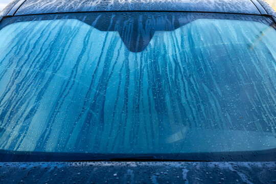 Condinsation on car windscreen. Running water on Black car windscreen. © Paul Howe
