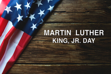 Martin Luther King Day Anniversary - American flag on wooden background