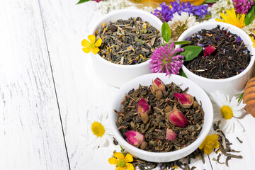 assortment of herbal tea on white background, top view