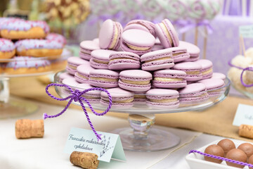 French macaroons on a rustic candy bar at the wedding party
