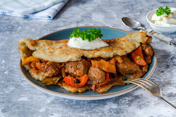 Hungarian goulash with potato pancake