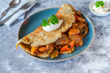 Hungarian goulash with potato pancake