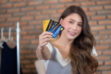 Woman holding credit card for online shopping