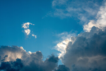 Fototapeta premium A ray of sunlight shines through the storm clouds