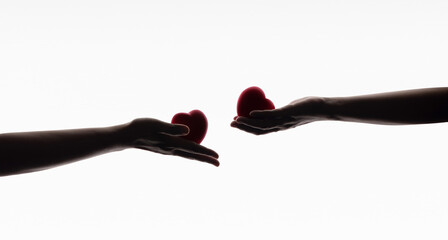 Love, Care, Donation and Sharing Concept. Silhouette of Hands with Heart symbol. isolated on White...