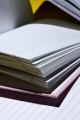 open notebooks are on top of each other. close-up.