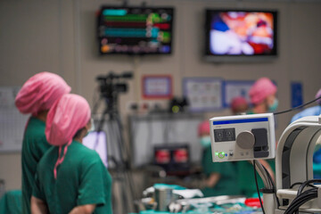 Vital signs monitor with machines during surgery on a patient in operating room.