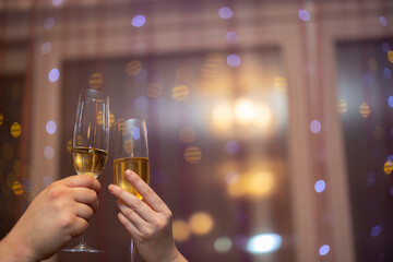 Close up view of man and women holding champagne glass. Love. Holiday.