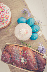 Vertical photo Easter eggs with Easter and flowers. Religious holidays concept