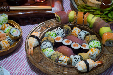 Holiday mixed set of fresh Japanese seafood sushi, rolls, nigiri and sashimi