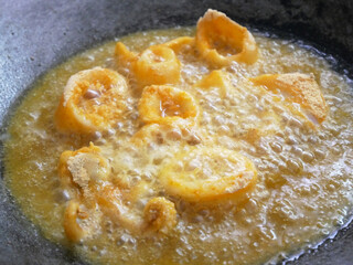 Squid cut into small pieces and fried with flour. The flour has been mixed with eggs to add flavour and to make it crisper.