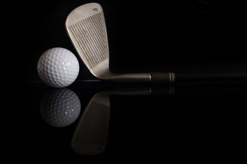 Golf balls and golf clubs to dark Background