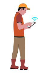 Young farmer holding tablet in hand