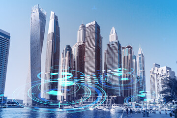 Naklejka premium Skyscrapers of Dubai business downtown. International hub of trading and financial services. Technology theme icons hologram, Fintech concept. Double exposure. Dubai Canal waterfront.