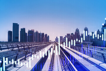 The way towards skyscrapers by modern futuristic train. Tech railway delivers commuters to the financial downtown of Dubai. International business hub. Traffic concept. FOREX graph. Double exposure