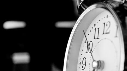 Black white big metallic clock close up. Time or showing time concept. Classic retro mechanical...