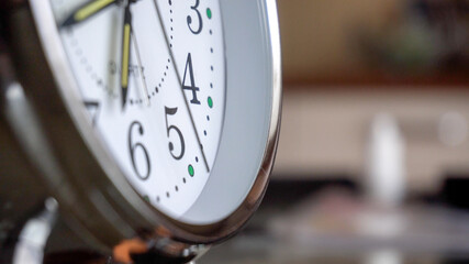 Big metallic clock close up. Time or showing time concept. Classic retro mechanical alarm clock