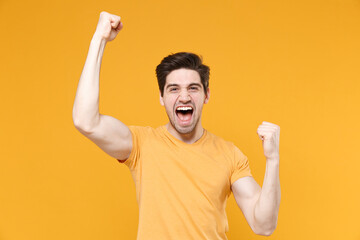 Young smiling unshaved caucasian handsome man 20s in casual basic blank print design t-shirt doing...