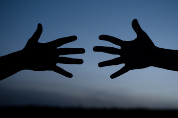Helping hand. Care and support concept. Silhouette. Two hands. Two palms.