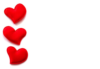 Valentine's Day greeting card. Red paper hearts isolated on a white background. Copy space.
