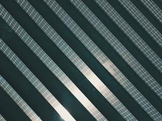 Aerial view of a solar farm producing clean renewable sun energy, industrial landscape