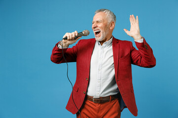 Cheerful elderly gray-haired mustache bearded business man wearing red jacket suit standing sing...