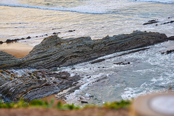 seascape on beach with stones eroded by the sea. Northern Spain, Basque Country. concept travel to spain winter