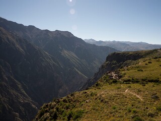 Panoramic view of deep Colca Canyon valley at Cruz del Condor cross viewpoint observation platform...
