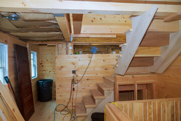 Unfinished wooden ceiling and wall boards of private house residential construction house framing