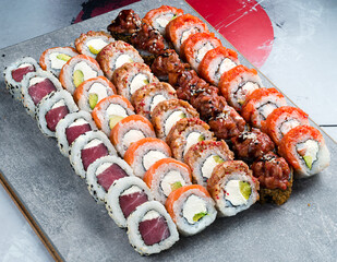 Different kinds of sushi roll. Japanese food set of different sushi rolls on a plate
