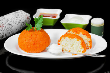 Beautiful, decorative and healthy food, colorful tangerine salad and sauces, on the table. Selective focus, black background