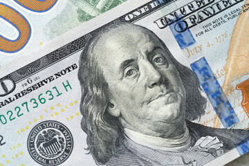 Obraz na płótnie Canvas Close up of new hundred dollar banknote corner.