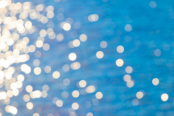 Bright bokeh on a blue background on the left