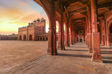 Fatehpur Sikri red sandstone architecture structure with view of columns and largest Indian mughal...
