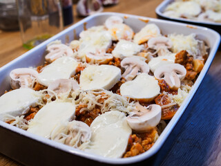 Pasta casserole with barbecue chicken breast, cheese and vegetables