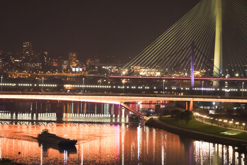 New so called Bridge over the Ada in Belgrade, capitol of Serbia. Beautiful night view on panoramic Belgrade 