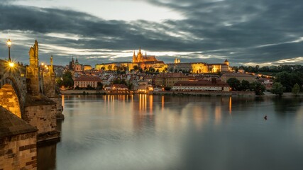 Charles Bridge over the Vltava River in Prague with castle in the background.